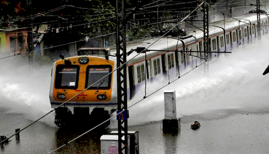 Mumbai back to work, train services restored | coastaldigest.com - The ...